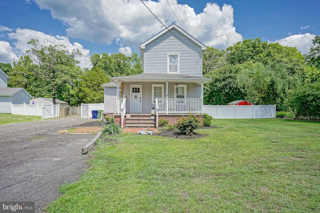 view of front facade with a porch and a front lawn