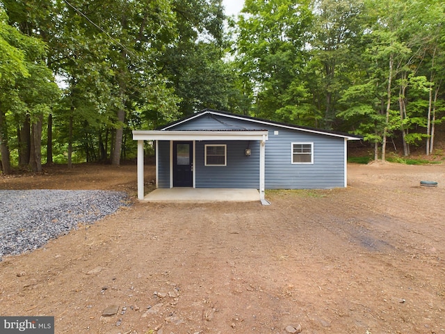 view of outdoor structure featuring covered porch