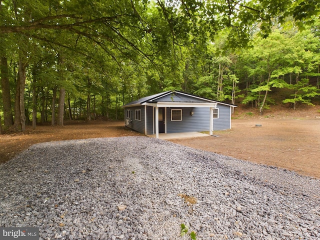 view of outbuilding featuring a carport