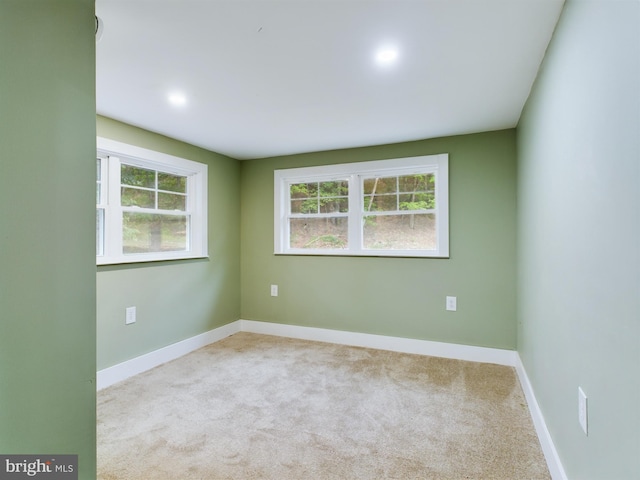 empty room featuring light colored carpet