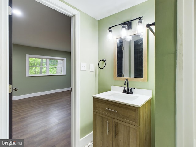 bathroom featuring vanity and wood-type flooring