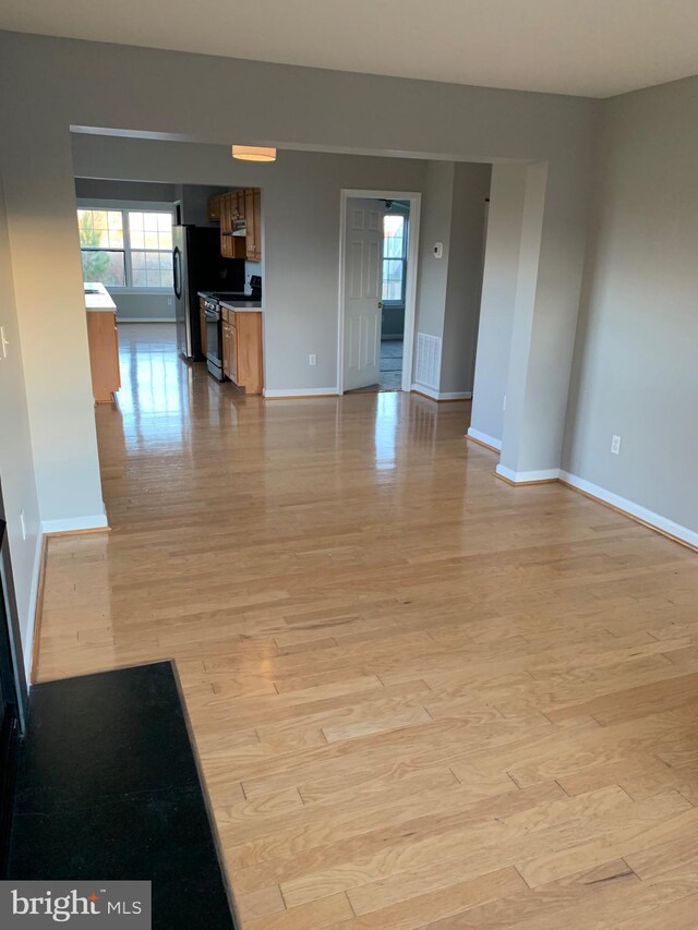 unfurnished living room featuring light hardwood / wood-style floors