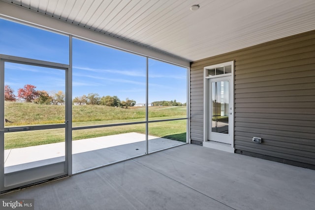 unfurnished sunroom with plenty of natural light