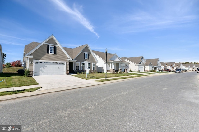 view of front of home featuring a front lawn and a garage