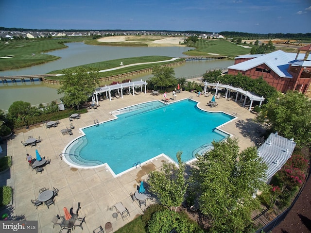 view of swimming pool featuring a water view, a pergola, and a patio area