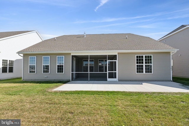 back of house with a lawn, a patio area, and a sunroom