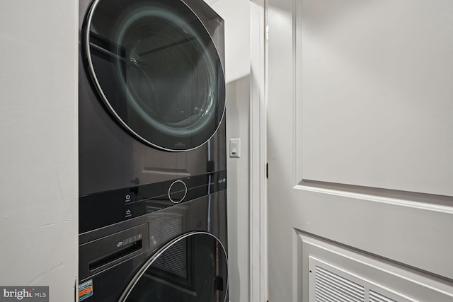 washroom with stacked washer and dryer