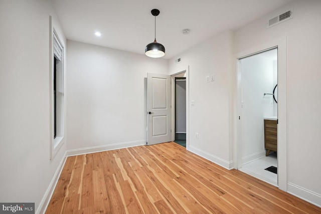 unfurnished bedroom featuring hardwood / wood-style floors