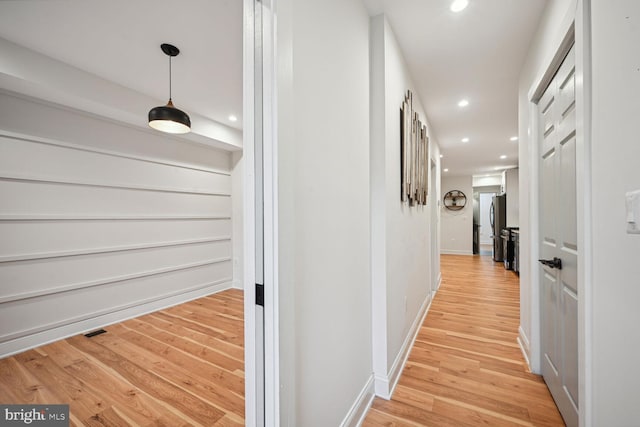 hallway featuring light hardwood / wood-style flooring