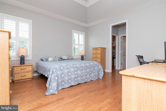 bedroom with hardwood / wood-style floors