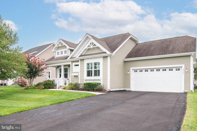 craftsman-style house with a garage and a front lawn