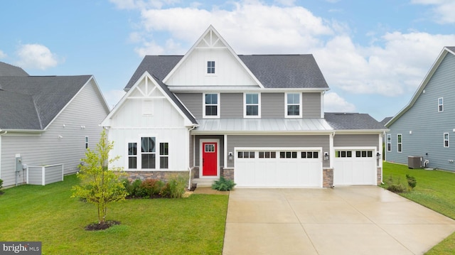 view of front facade featuring central AC unit, a garage, and a front yard