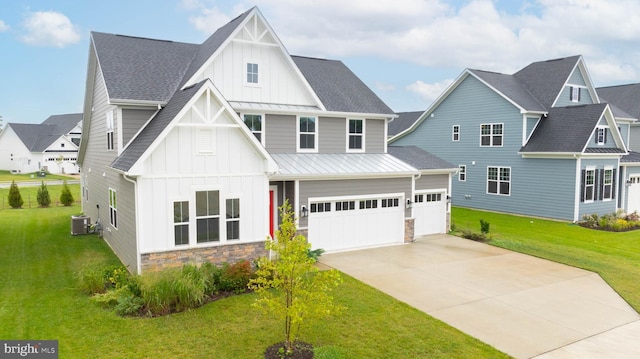 modern farmhouse featuring a garage, a front yard, and central AC unit