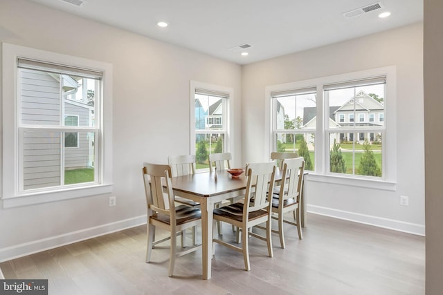 dining room with hardwood / wood-style flooring