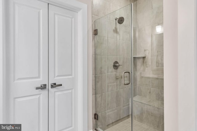 bathroom featuring an enclosed shower