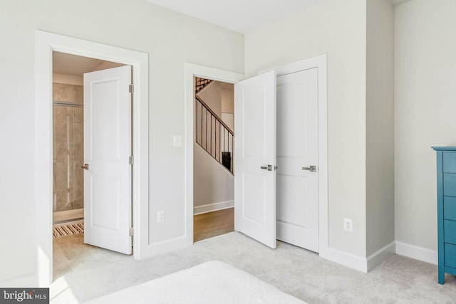 carpeted bedroom featuring connected bathroom