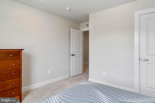 unfurnished bedroom with light colored carpet