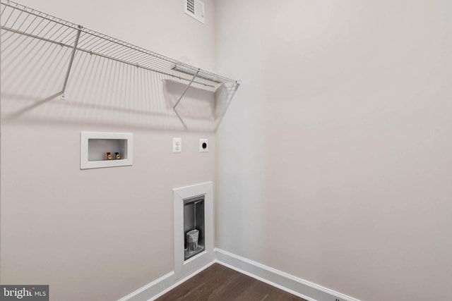 clothes washing area with washer hookup, dark hardwood / wood-style flooring, and hookup for an electric dryer