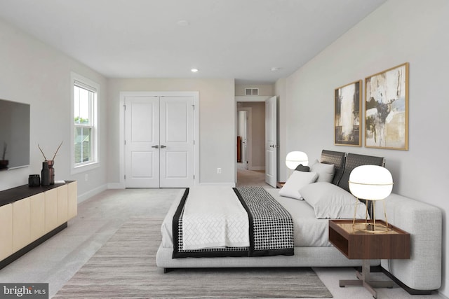 carpeted bedroom featuring a closet