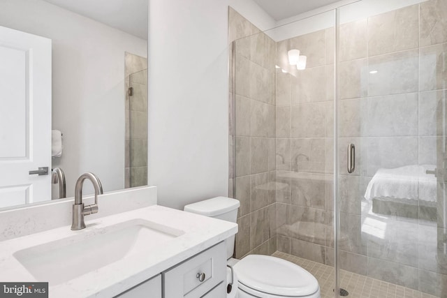 bathroom with vanity, toilet, and a shower with shower door