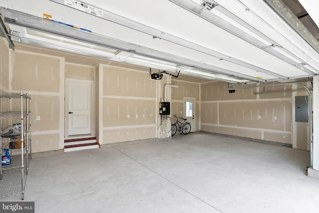 garage featuring a garage door opener and electric panel