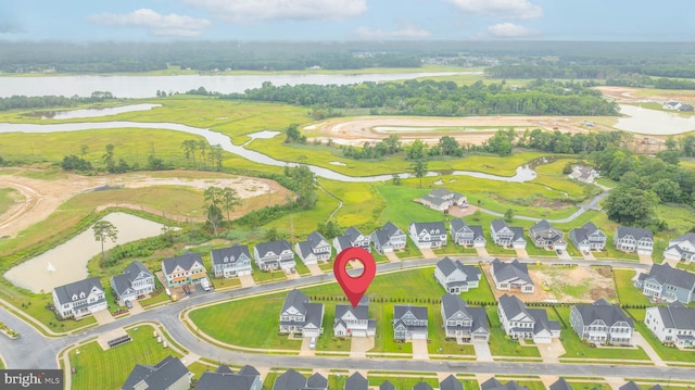 birds eye view of property featuring a water view