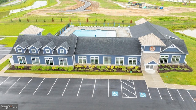 birds eye view of property featuring a water view