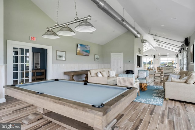 playroom with pool table and high vaulted ceiling