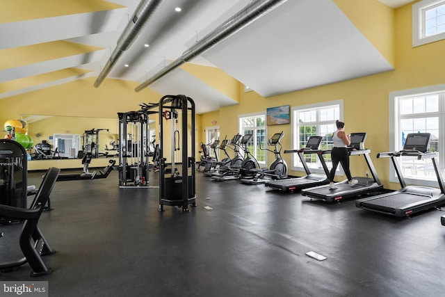 gym with high vaulted ceiling