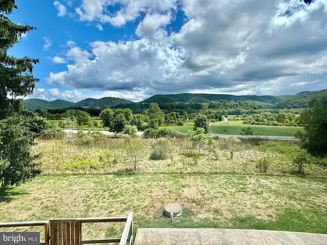 view of mountain feature with a rural view