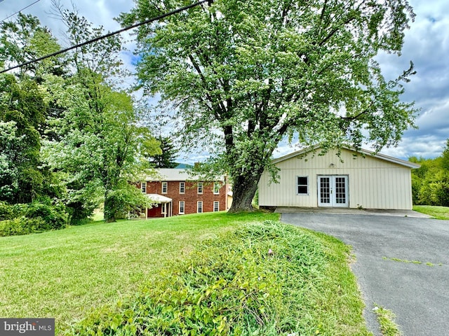 view of yard featuring french doors