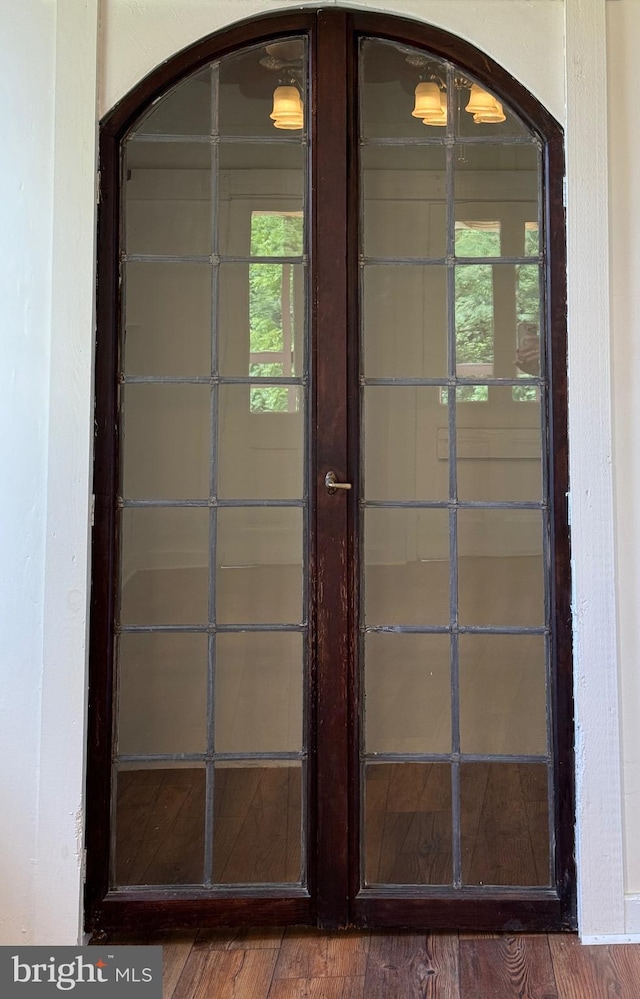 details featuring hardwood / wood-style flooring and french doors