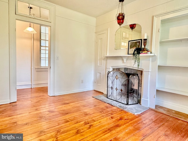 unfurnished living room with hardwood / wood-style floors