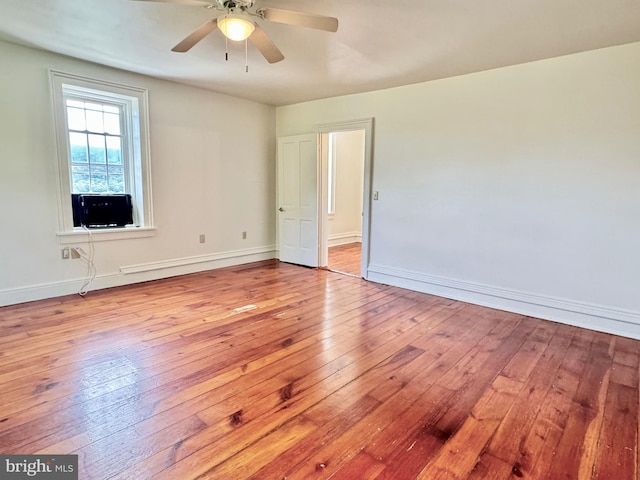 spare room with ceiling fan and light hardwood / wood-style floors