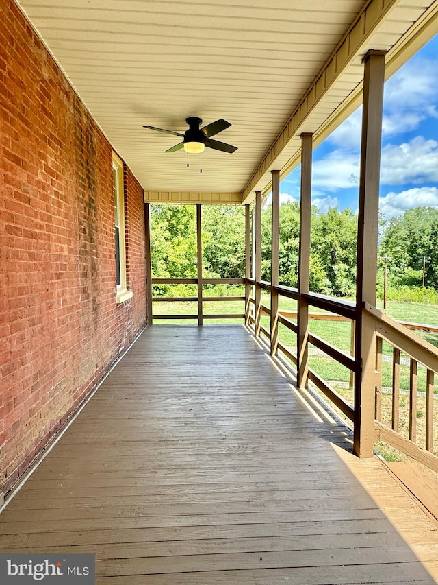 wooden deck with ceiling fan