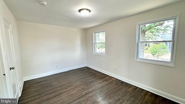 unfurnished bedroom featuring dark hardwood / wood-style flooring