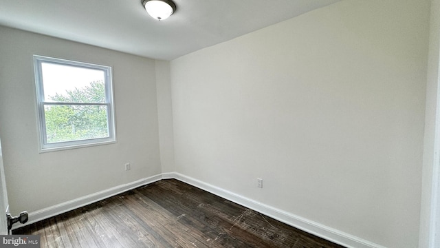 unfurnished room with wood-type flooring