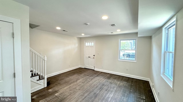 entrance foyer with dark hardwood / wood-style flooring