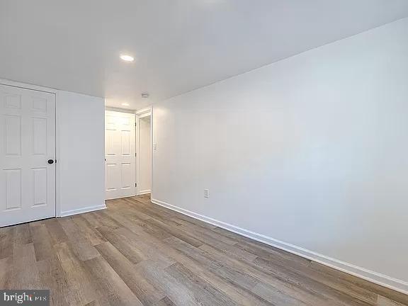 spare room featuring hardwood / wood-style flooring