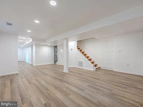 basement with light hardwood / wood-style floors