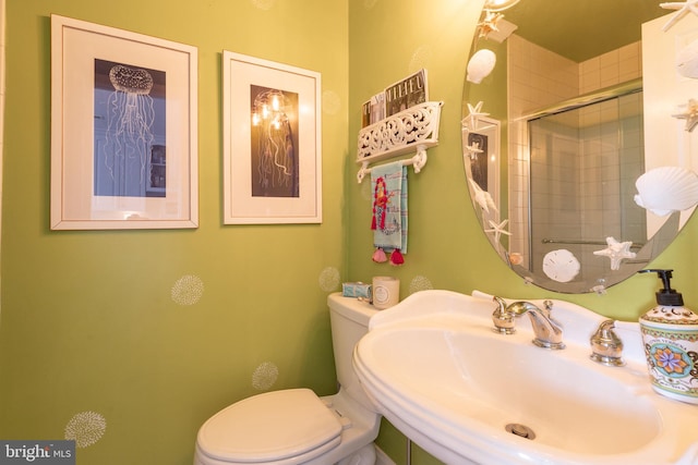 bathroom featuring sink and toilet