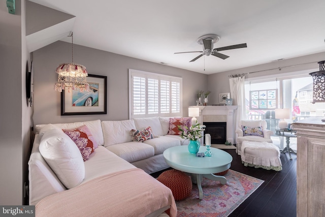 living room with hardwood / wood-style floors and ceiling fan