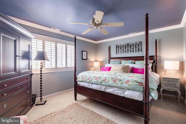 carpeted bedroom featuring ceiling fan and ornamental molding