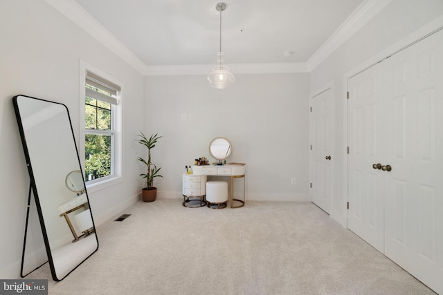 sitting room featuring light colored carpet and crown molding