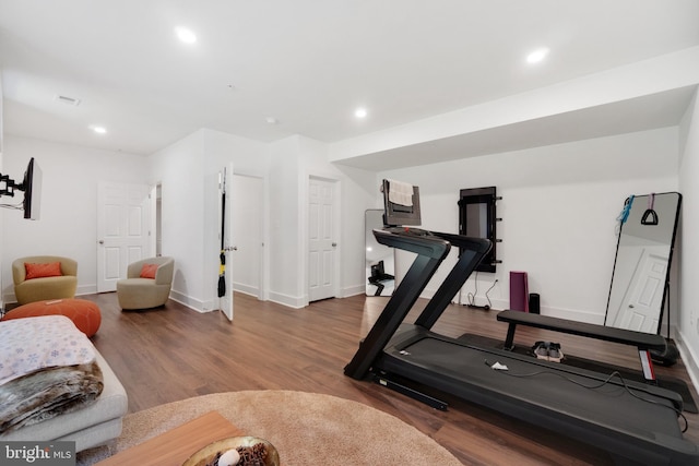 exercise area featuring hardwood / wood-style floors