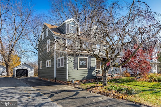 exterior space featuring an outdoor structure and a garage