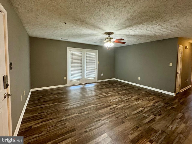 interior space featuring a textured ceiling, dark hardwood / wood-style flooring, and ceiling fan