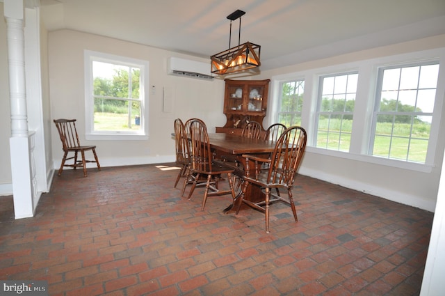 dining area featuring a wall mounted AC