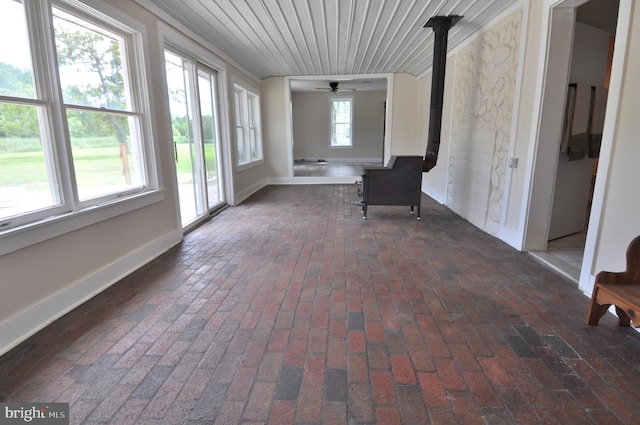 unfurnished sunroom featuring wooden ceiling