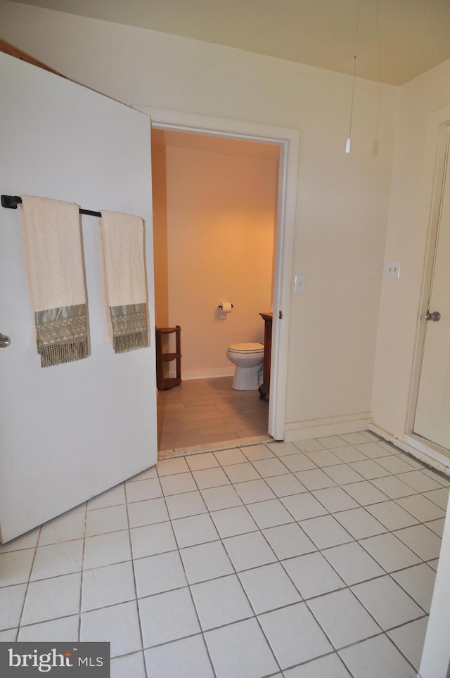 bathroom featuring tile patterned floors and toilet